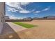 Landscaped backyard with brick patio and artificial turf at 8541 S Pioneer Way, Las Vegas, NV 89113