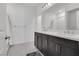 Double vanity bathroom with dark brown cabinets at 8541 S Pioneer Way, Las Vegas, NV 89113