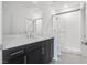 Modern bathroom with a large vanity and walk-in shower at 8541 S Pioneer Way, Las Vegas, NV 89113