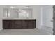 Modern bathroom with dark brown vanity and marble counters at 8541 S Pioneer Way, Las Vegas, NV 89113