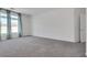 Bright bedroom featuring grey carpet and large windows at 8541 S Pioneer Way, Las Vegas, NV 89113