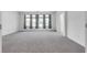 Bright and airy bedroom with large windows and grey carpet at 8541 S Pioneer Way, Las Vegas, NV 89113