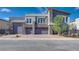 Contemporary home with stone accents and three-car garage at 8541 S Pioneer Way, Las Vegas, NV 89113