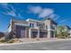 Contemporary home with stone accents and three-car garage at 8541 S Pioneer Way, Las Vegas, NV 89113