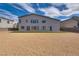 Two story home with artificial turf and gravel backyard at 8541 S Pioneer Way, Las Vegas, NV 89113