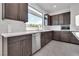 Modern kitchen with stainless steel appliances and white quartz countertops at 8541 S Pioneer Way, Las Vegas, NV 89113