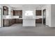 Modern kitchen features dark cabinetry, island, and stainless steel appliances at 8541 S Pioneer Way, Las Vegas, NV 89113