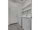 Laundry room with washer, dryer, and shelving at 8541 S Pioneer Way, Las Vegas, NV 89113