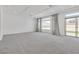 Open living space with large windows and access to backyard at 8541 S Pioneer Way, Las Vegas, NV 89113