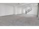 Bright and airy living room with high ceilings and modern staircase at 8541 S Pioneer Way, Las Vegas, NV 89113