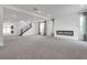 Bright and airy living room featuring a modern fireplace and high ceilings at 8541 S Pioneer Way, Las Vegas, NV 89113