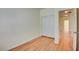 Bedroom with wood-look floors and sliding closet doors at 8557 Nature Scene Dr, Las Vegas, NV 89139