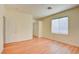 Well-lit bedroom featuring wood-look floors and ample closet space at 8557 Nature Scene Dr, Las Vegas, NV 89139