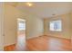 Spacious bedroom with wood flooring and large window at 8557 Nature Scene Dr, Las Vegas, NV 89139