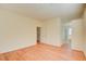 Bright bedroom with wood-look floors and access to a bathroom at 8557 Nature Scene Dr, Las Vegas, NV 89139