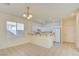 Bright dining room with large windows and kitchen view at 8557 Nature Scene Dr, Las Vegas, NV 89139