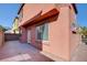 Home's exterior with private patio and brick wall at 8557 Nature Scene Dr, Las Vegas, NV 89139