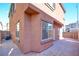 Private patio with flagstone and adjacent to the home's exterior wall at 8557 Nature Scene Dr, Las Vegas, NV 89139