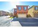 Two-story townhome with attached garage and landscaping at 8557 Nature Scene Dr, Las Vegas, NV 89139
