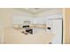 Kitchen boasts a large island and white cabinetry at 8557 Nature Scene Dr, Las Vegas, NV 89139