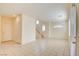 Spacious living area with adjacent kitchen and stairs at 8557 Nature Scene Dr, Las Vegas, NV 89139
