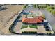 Expansive backyard with a pool, lush greenery, and ample space for outdoor activities at 8880 W Ann Rd, Las Vegas, NV 89149