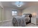 Cozy bedroom features soft carpet, neutral walls, and a comfortable bed with stylish bedding and pillows at 8880 W Ann Rd, Las Vegas, NV 89149
