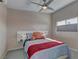 Cozy bedroom with ceiling fan, natural light, and comfortable furnishings at 8880 W Ann Rd, Las Vegas, NV 89149