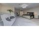 Primary bedroom features a sitting area, bed, carpeted floors, and ample natural light at 8880 W Ann Rd, Las Vegas, NV 89149
