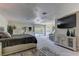 Spacious bedroom with sitting area, carpeted floors, and a sliding door to the backyard at 8880 W Ann Rd, Las Vegas, NV 89149
