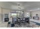 Bright dining area featuring a modern table, chic chairs, and contemporary decor at 8880 W Ann Rd, Las Vegas, NV 89149