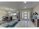 Inviting entryway with stylish tile flooring, modern light fixture, and sleek decor at 8880 W Ann Rd, Las Vegas, NV 89149