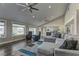 Inviting living room with plush seating, expansive windows, and a seamless flow to the outdoor area at 8880 W Ann Rd, Las Vegas, NV 89149
