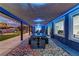 Inviting covered patio with large dining table and outdoor seating, perfect for entertaining guests at 8880 W Ann Rd, Las Vegas, NV 89149