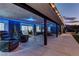 Relaxing covered patio featuring comfortable seating, lush greenery, and inviting ambiance at 8880 W Ann Rd, Las Vegas, NV 89149