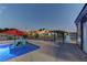 Inviting pool area with comfortable lounge chairs and well-manicured landscaping, creating a relaxing retreat at 8880 W Ann Rd, Las Vegas, NV 89149