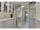 Organized walk-in closet featuring custom shelving, drawers, and mirrored doors for ample storage at 8880 W Ann Rd, Las Vegas, NV 89149