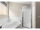 Corner view of the tub and shower stall in a brightly lit and clean bathroom at 1428 Chaparral Dr, Mesquite, NV 89027