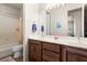 Bathroom features a large mirror, double sinks and a tub with shower at 1428 Chaparral Dr, Mesquite, NV 89027