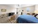 Spacious bedroom features a ceiling fan, natural light and a seating area at 1428 Chaparral Dr, Mesquite, NV 89027