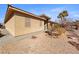 Single-story home featuring low-maintenance landscaping and a paved walkway at 1428 Chaparral Dr, Mesquite, NV 89027