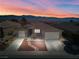 Beautiful single-story home featuring desert landscaping, a paver walkway, and a 2-car garage with mountain views at 1428 Chaparral Dr, Mesquite, NV 89027