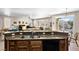 Open-concept kitchen with breakfast bar overlooking the living area and backyard at 1428 Chaparral Dr, Mesquite, NV 89027