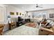 Bright living room with cozy seating, large windows, and neutral color palette at 1428 Chaparral Dr, Mesquite, NV 89027