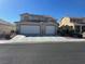 Charming two-story home featuring a large two-car garage and well-manicured landscaping at 1733 Gentle Brook St, North Las Vegas, NV 89084