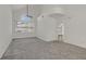 Bright living room featuring a large window and grey carpeting at 176 Mirador St, Henderson, NV 89074