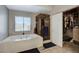 Well-lit bathroom features a bathtub, stand-up shower, and a closet for storing belongings at 190 Mount Saint Helens Dr, Henderson, NV 89012