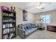 Cozy bedroom featuring a comfortable sofa, ceiling fan, and fitness equipment at 190 Mount Saint Helens Dr, Henderson, NV 89012