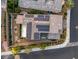 Aerial view of a home with solar panels, well-maintained landscaping, and stylish outdoor living spaces at 1945 Canyon Highlands Dr, Henderson, NV 89052