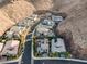 Scenic aerial view of a neighborhood nestled in a desert mountain landscape, featuring modern homes at 1945 Canyon Highlands Dr, Henderson, NV 89052